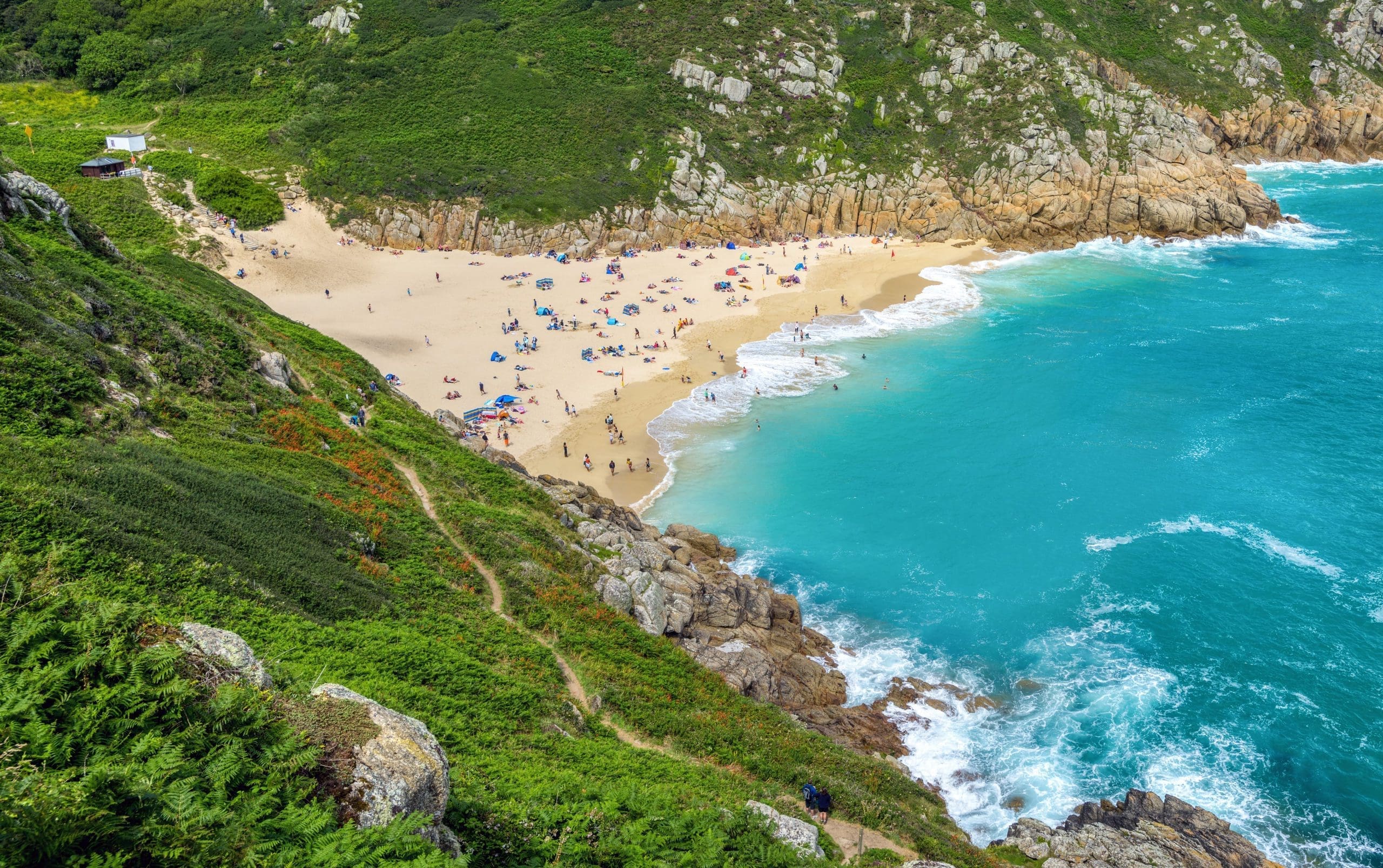 Sunbathers on Porthcurno Beach, Cornwall