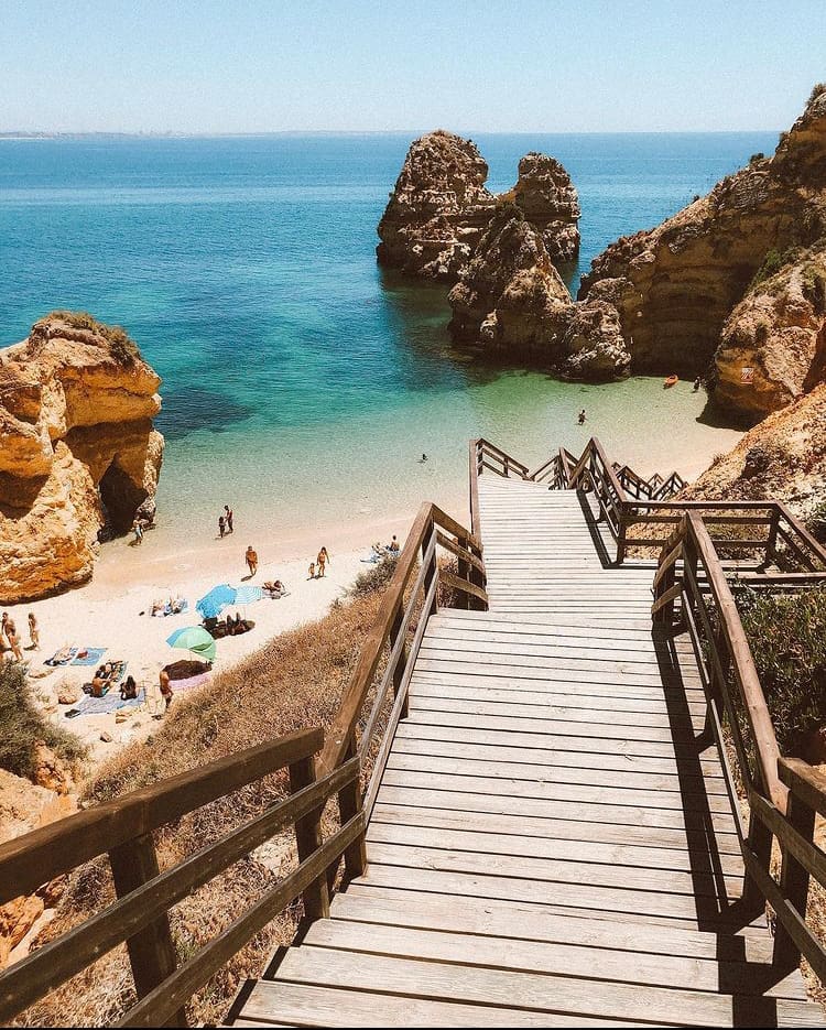 The wooden walkway down to Praia do camilo