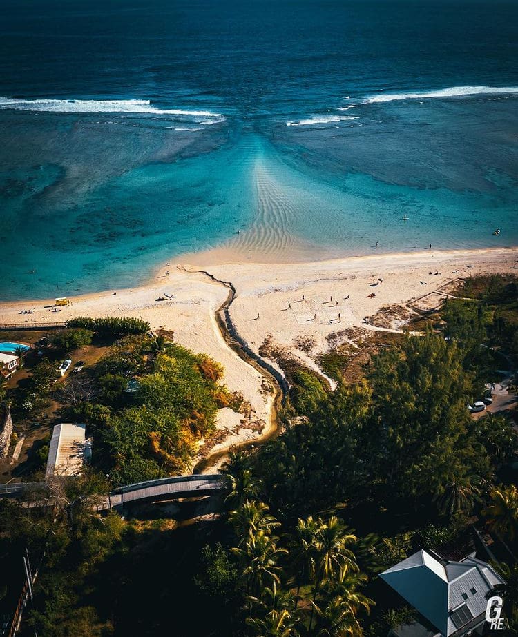 Aerial views over the beach and luxury houses in the Reunion Island - The Best Islands In France For a Luxury Getaway