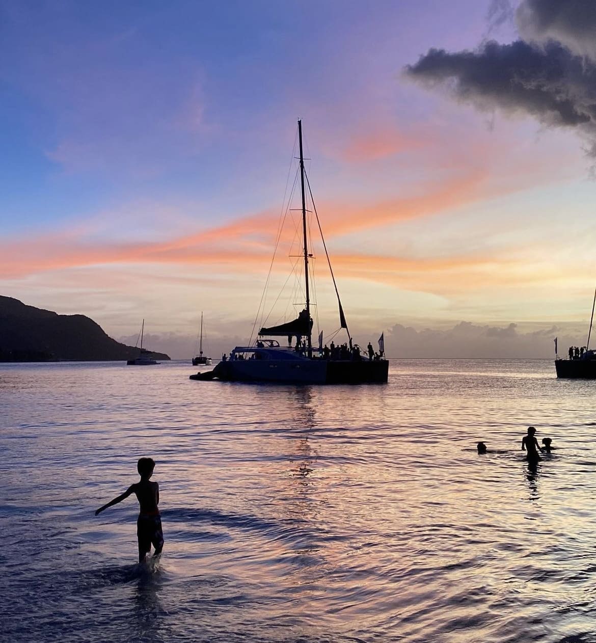 Children play in the sea at Beau Vallon Beach
