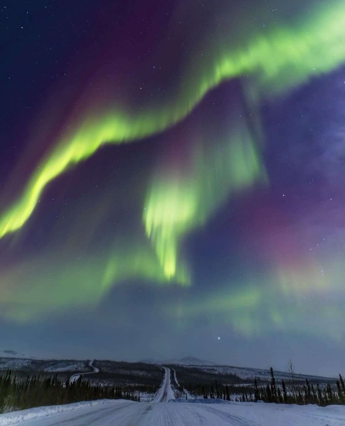 The Aurora over the Ice Road in Alaska