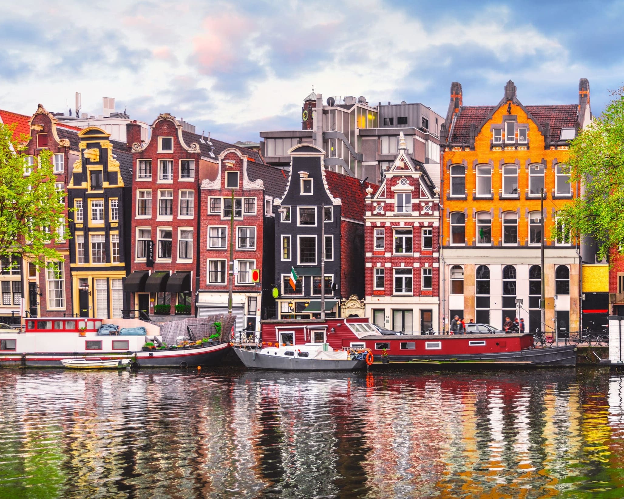 Amsterdam Netherlands dancing houses over river Amstel landmark in old european city spring landscape.