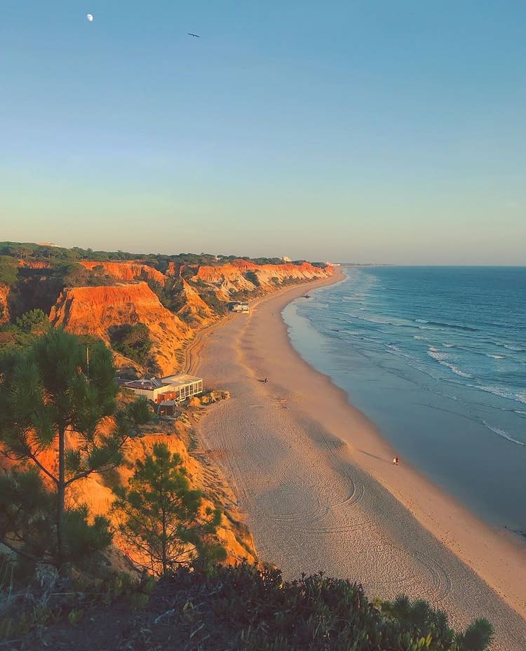 The sun sets over Praia de falesia - The 10 Most Beautiful Beaches In Portugal