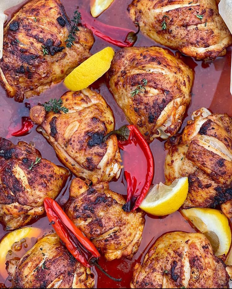 Portuguese chicken piri-piri in sauce with chillis and lemon
