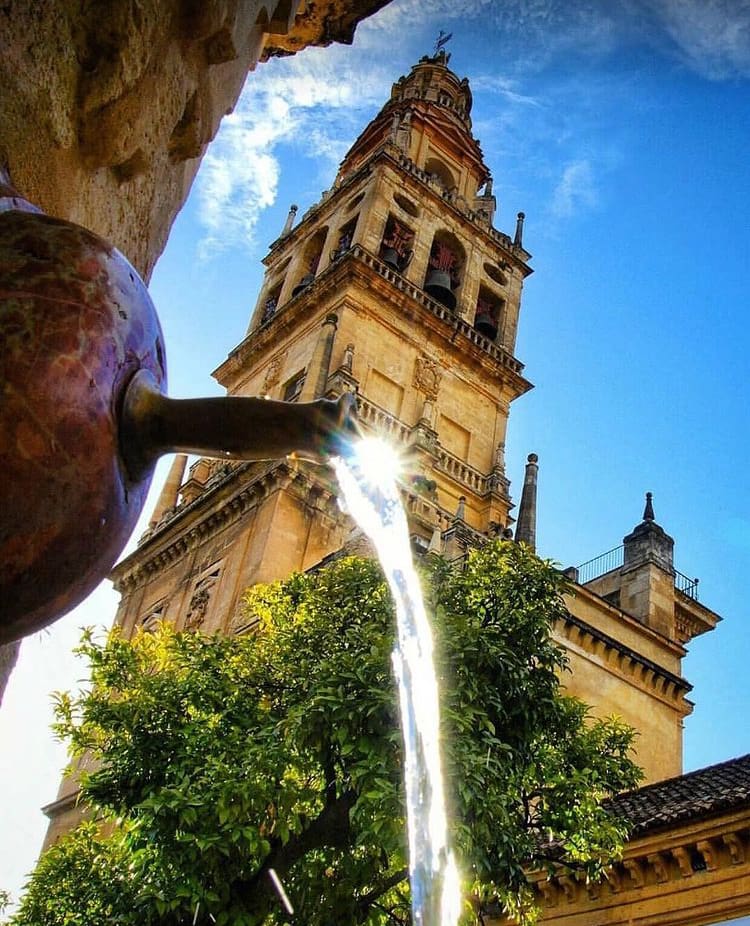 The fountain beneath the bell tower of the Le Mezquita cathedral 