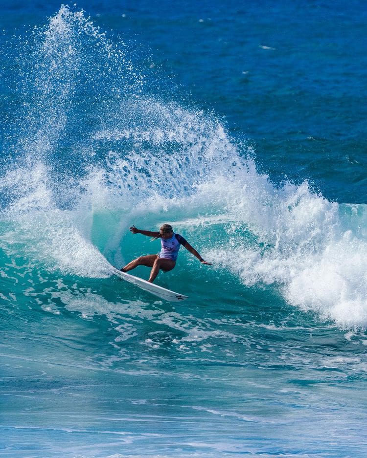 Gabriela Bryan surfing at Sunset Beach, Hawaii