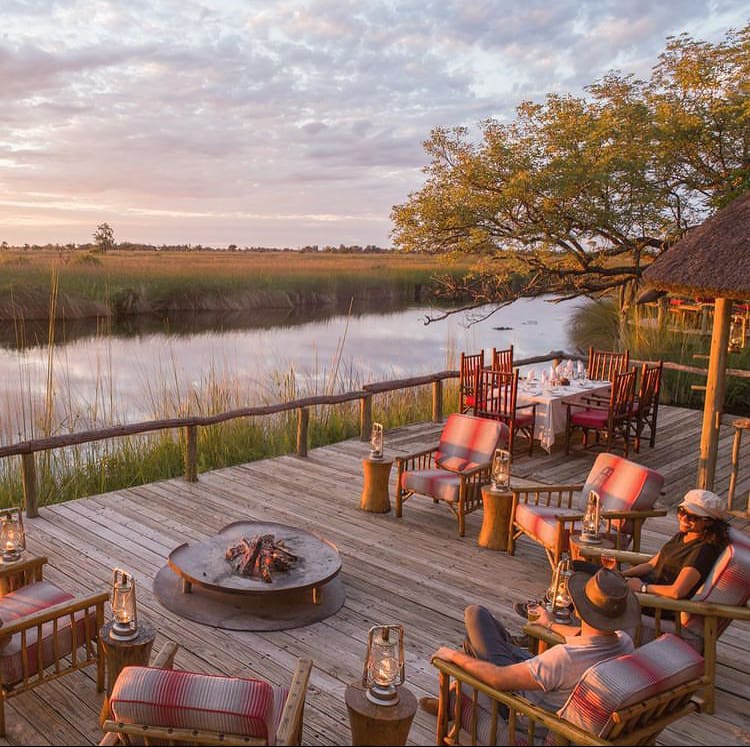 Relaxing on a river viewing deck at a luxury game lodge in Botswana