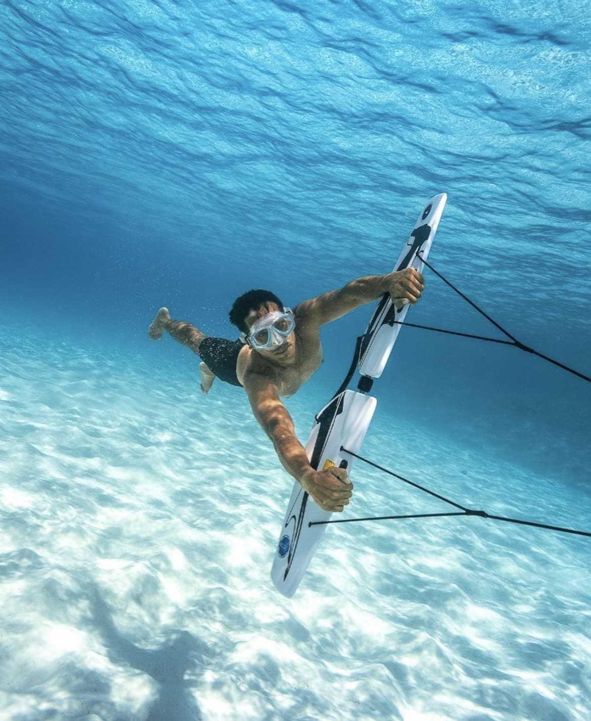 Man riding a subwing in the Maldives