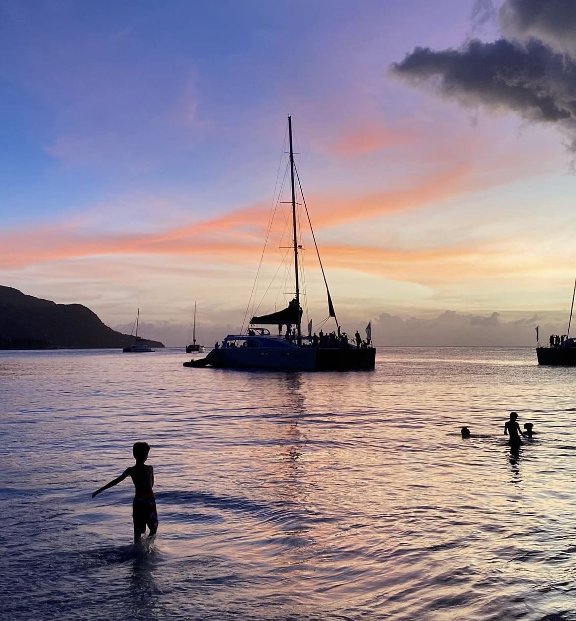 Children play in the sea at Beau Vallon Beach