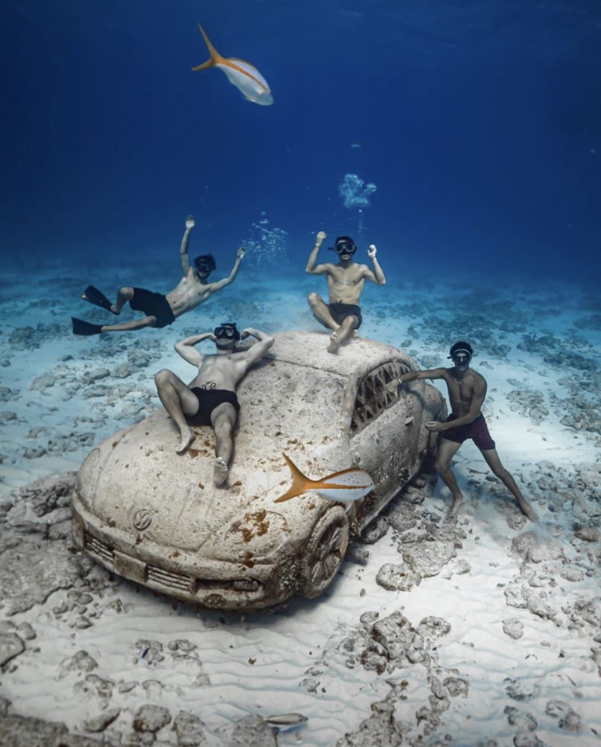 Friends enjoying a submerged vehicle at the Cancun Underwater Museum