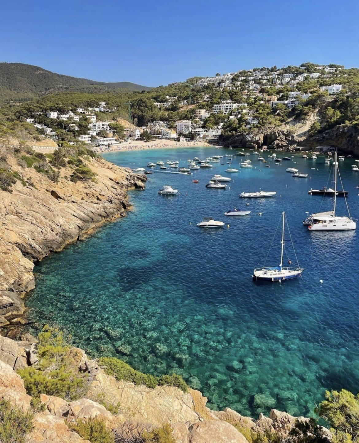 Picturesque blue waters in Cala Vadella, Ibiza