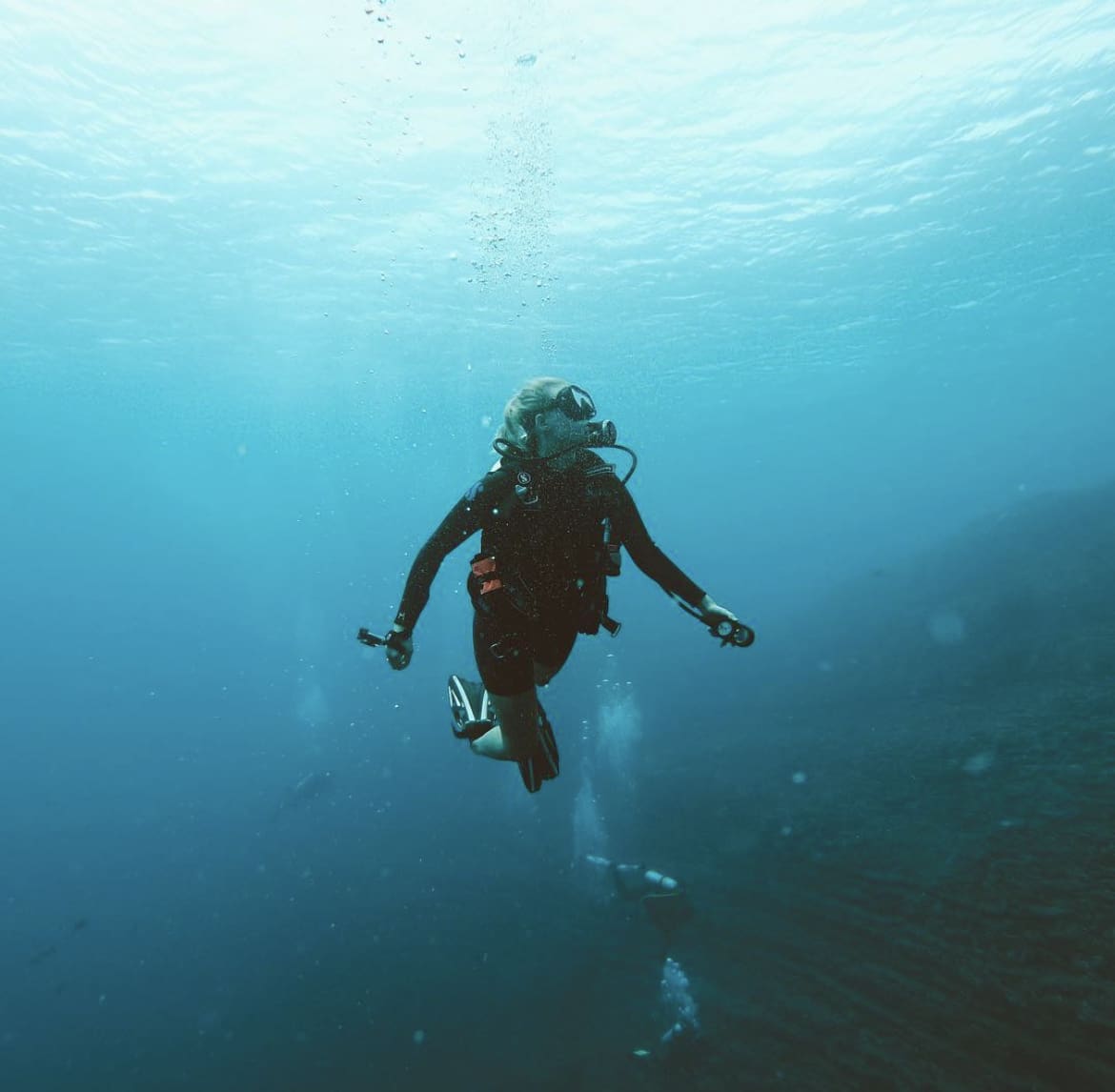 Scuba diving in the deep blue waters of Hawaii's North Shore