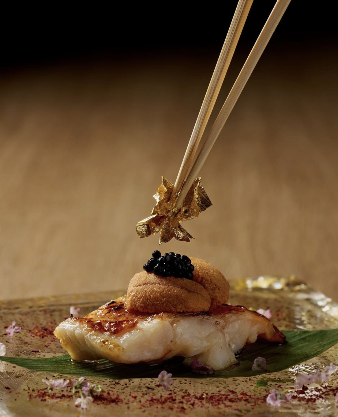 Grilled kinki fish topped with uni, caviar and gold flake