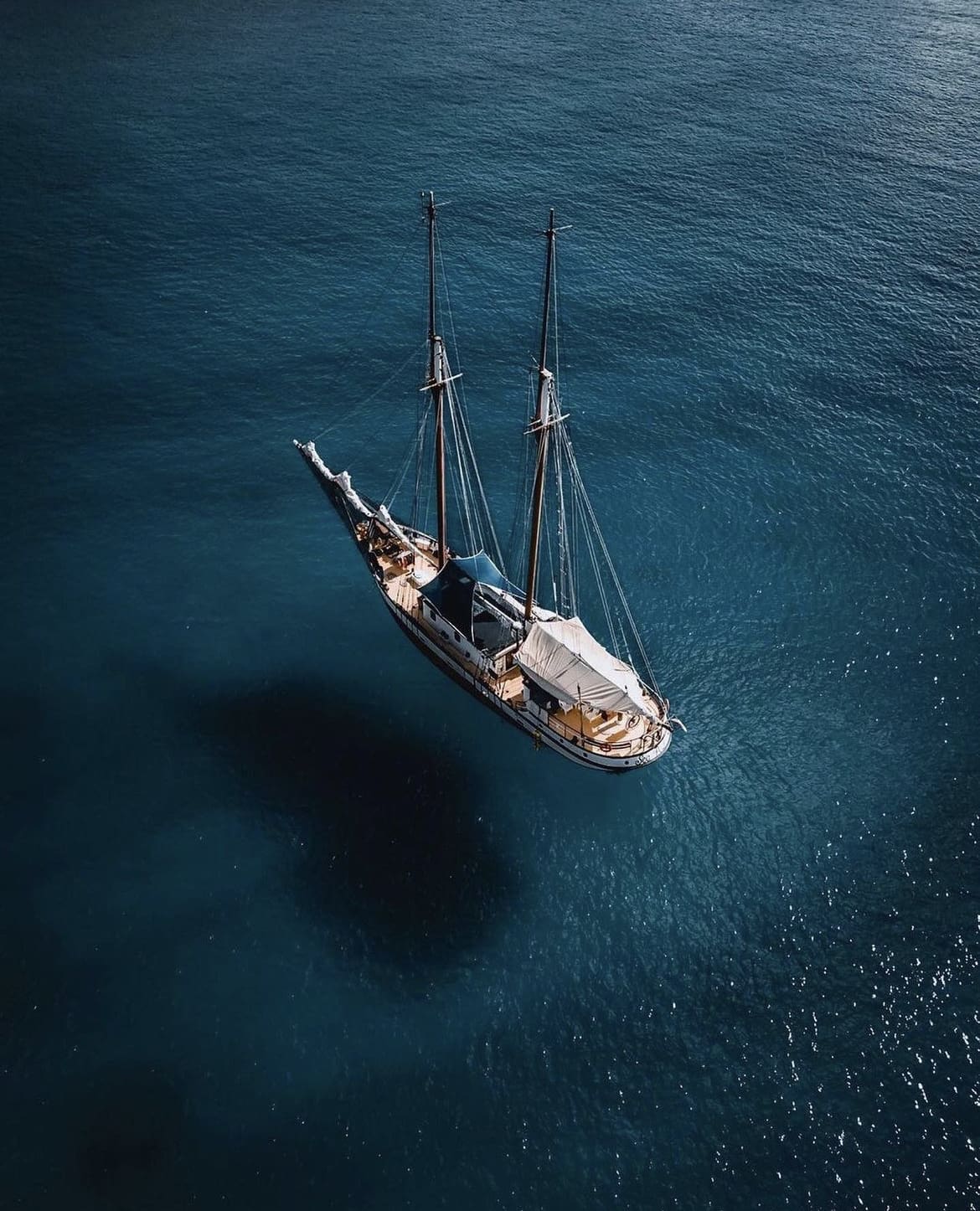 Sailing boat resting on the deep blue bay