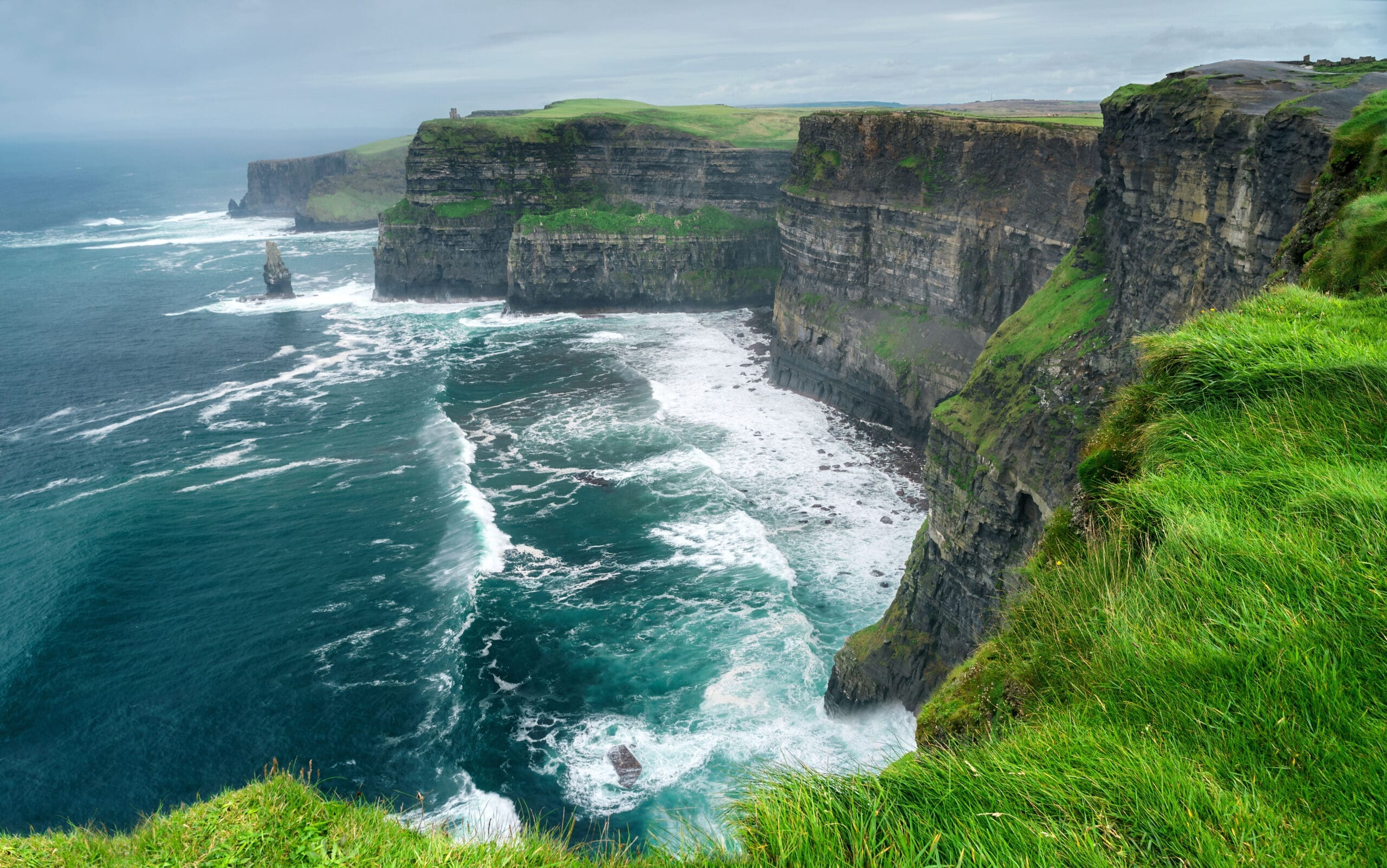 Spectacular view of famous Cliffs of Moher and wild Atlantic Ocean, County Clare, Ireland.