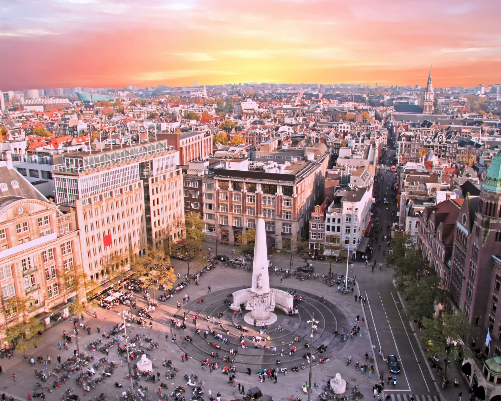 City scenic from Amsterdam with the Dam in the Netherlands at sunset